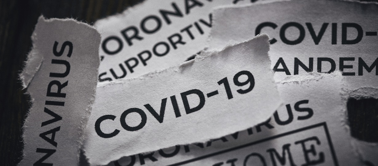 Ripped pieces of paper that have different ways of saying coronavirus or COVID-19