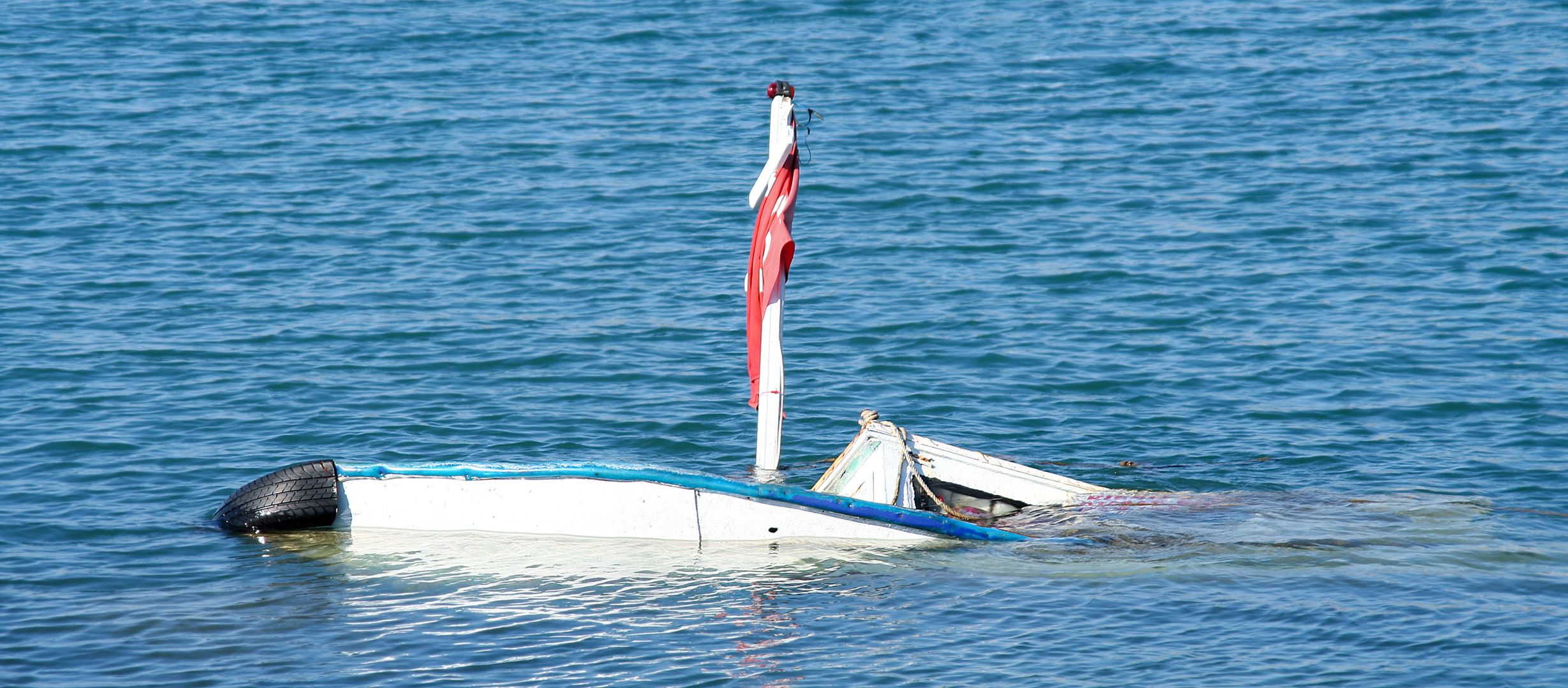 Boat sinking in the ocean